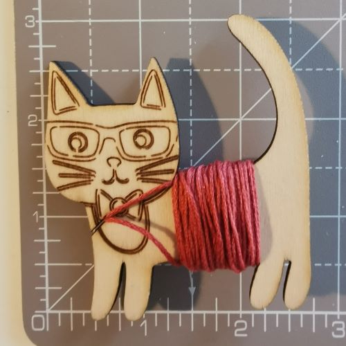 Wooden floss bobbins. Clever Cat