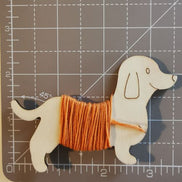Wooden floss bobbins. Sausage Dog