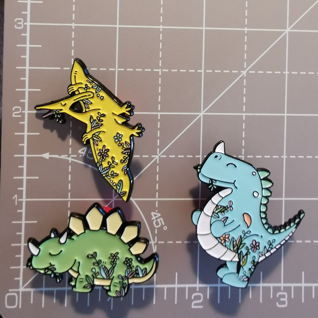 Needle Minder - Friendly floral dinosaurs, prehistoric.