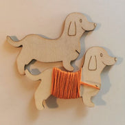 Wooden floss bobbins. Sausage Dog